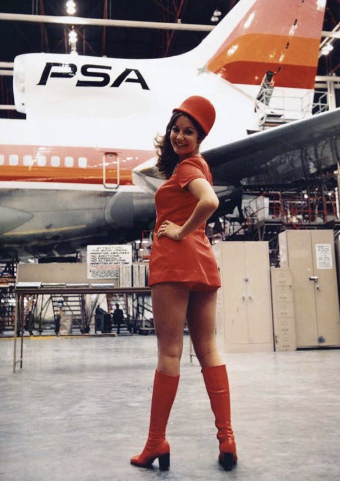 A Pacific Southwest Airlines stewardess in go-go boots, 1970. 